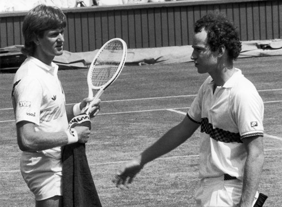 American tennis star John McEnroe about to shake the hand of South African player Kevin Curren after losing in 1985