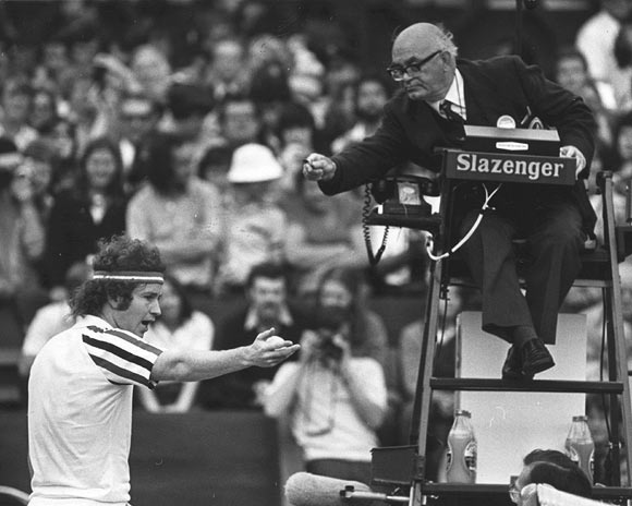 John McEnroe argues with the umpire