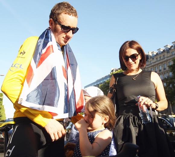 Bradley Wiggins of Great Britain and SKY Procycling celebrates with his wife Cath and children