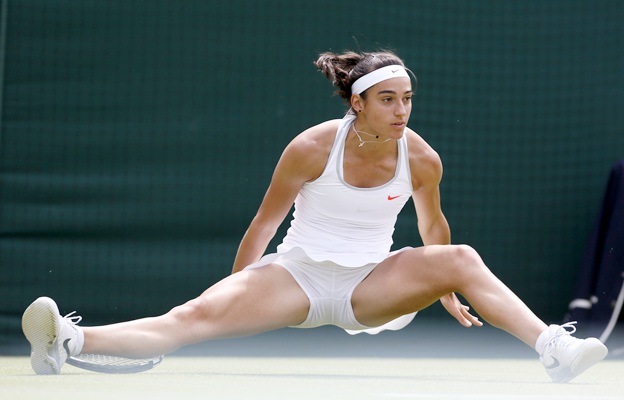 Caroline Garcia of France slips during her women's singles match against Serena Williams