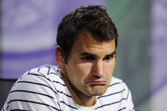 Roger Federer of Switzerland speaks to members of the media during a press conference
