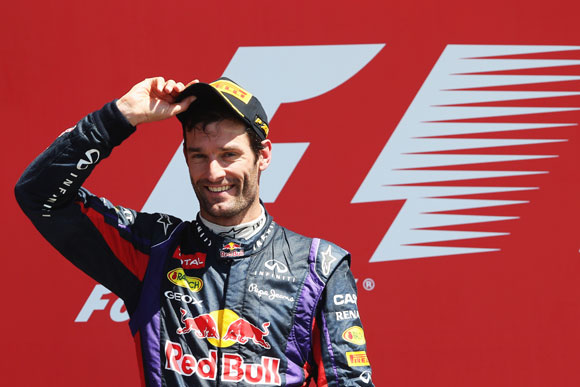 Mark Webber of Australia and Infiniti Red Bull Racing celebrates on the podium after finishing second