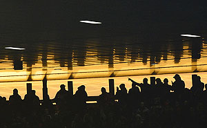 Arsenal fans watch a match at the Emirates stadium