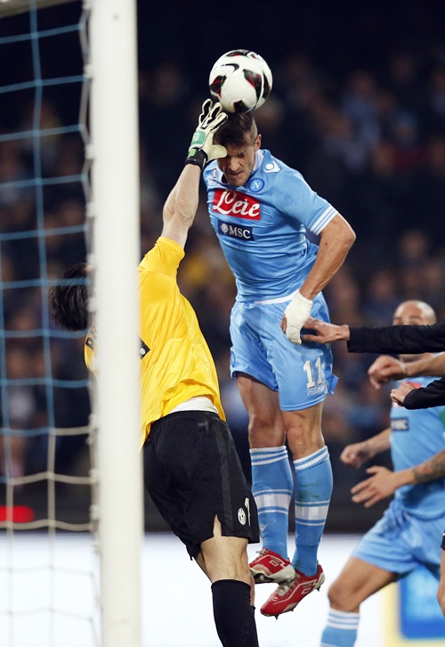 Juventus' goalkeeper Gianluigi Buffon (left) makes a save against Napoli's Christian Maggio
