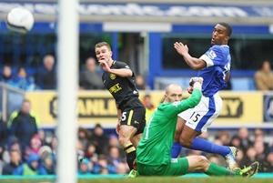 Callum McManaman (left) of Wigan Athletic scores