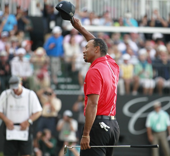 Tiger Woods reacts after his final putt