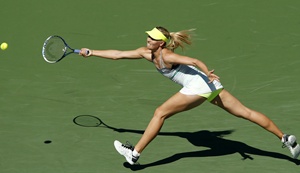Maria Sharapova of Russia lunges for the ball