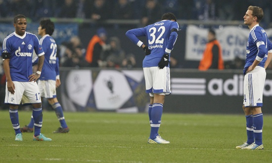 Schalke 04 players react following their defeat against Galatasaray