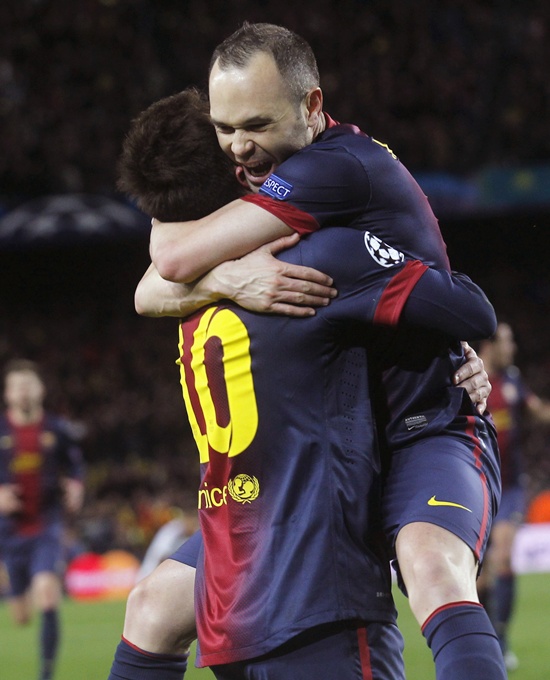 Barcelona's Lionel Messi celebrates with Andres Iniesta (right)