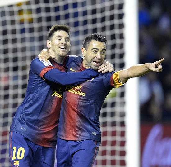 Barcelona's Xavi Hernandez (centre), Lionel Messi
