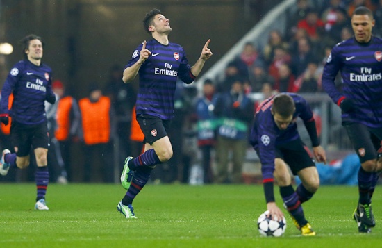 Olivier Giroud (centre) of Arsenal celebrates his goal against Bayern Munich