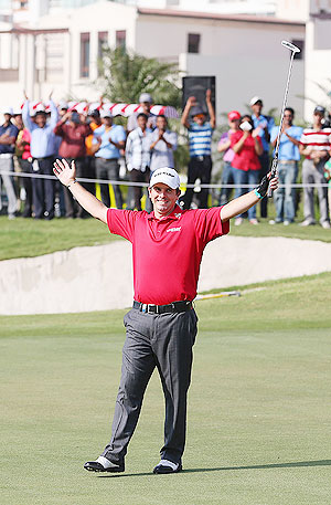Thomas Aiken of South Africa celebrates victory on the 18th green after a birdie putt during day four of the Avantha Masters at Jaypee Greens Golf Club on Sunday
