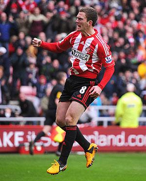 Craig Gardner of Sunderland celebrates scoring a penalty to equalise against Norwich City at the Stadium of Light on Sunday