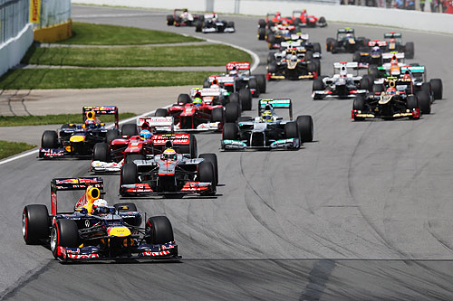 Sebastian Vettel of Germany and Red Bull Racing leads the field into the first corner at the start of the Canadian Formula One Grand Prix at the Circuit Gilles Villeneuve on June 10, 2012 in Montreal, Canada