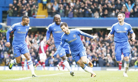 Eden Hazard of Chelsea (centre) celebrates scoring against West Ham