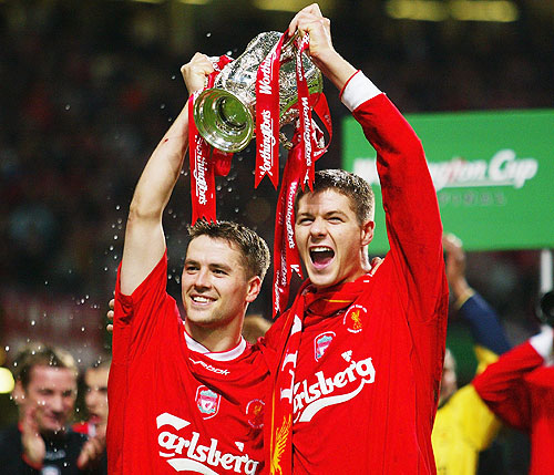 Goalscorers Michael Owen and Steven Gerrard of Liverpool celebrate with the trophy during the Worthington Cup Final between Liverpool and Manchester United held on March 2, 2003 at the Millennium Stadium, in Cardiff, Wales. Liverpool won the match and final 2-0