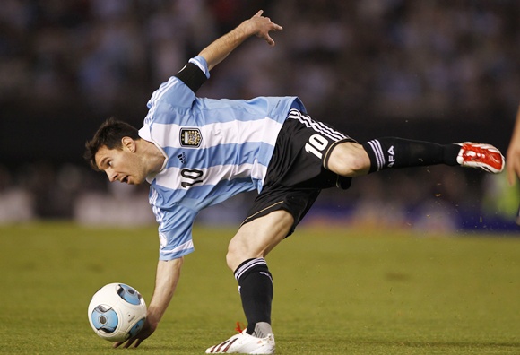 Argentina's Leonel Messi loses his balance