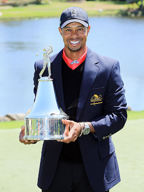 Tiger Woods of the United States holds the trophy after winning the final round of the 2013 Arnold Palmer Invitational at Bay Hill Golf and Country Club in Orlando, Florida on Monday