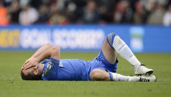 Chelsea's captain John Terry lies on the ground