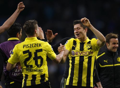 Borussia Dortmund's Robert Lewandowski and Lukasz Piszczek (left) celebrate