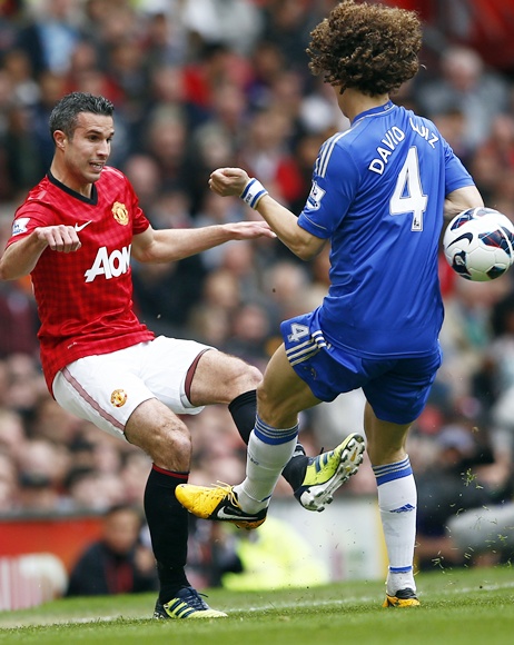 Chelsea's David Luiz challenges Manchester United's Robin van Persie (left)
