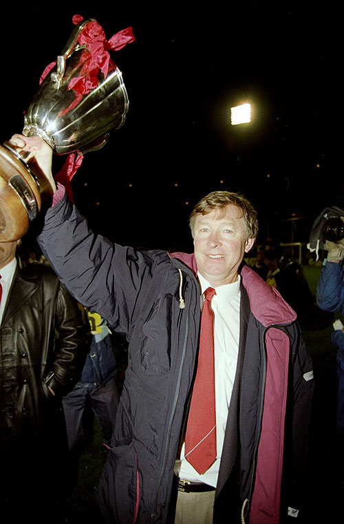 Manchester United Manager Alex Ferguson holds the trophy aloft after the European Cup Winners Cup final against Barcelona at the Feyenoord Stadium in Rotterdam, Hollandon My 15, 1991