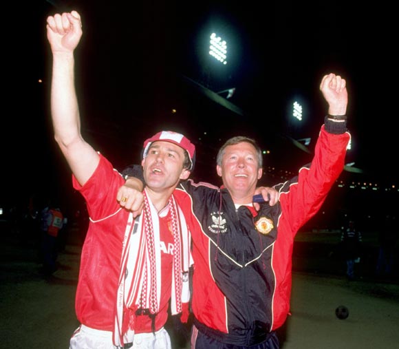 Alex Ferguson (right) and Bryan Robson celebrate after Manchester United won the FA Cup in 1990