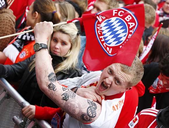 Bayern Munich supporters wait for the Bayern team