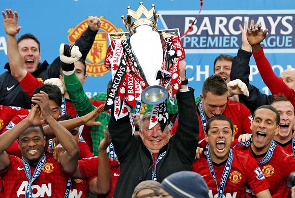 Manchester United manager Alex Ferguson lifts the English Premier League trophy