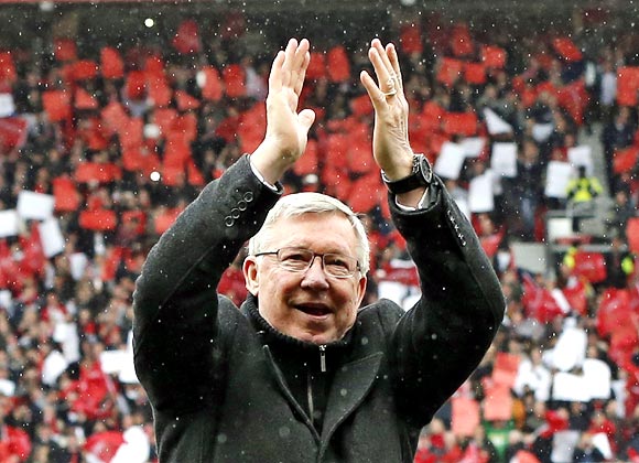 Manchester United manager Alex Ferguson applauds to the crowd