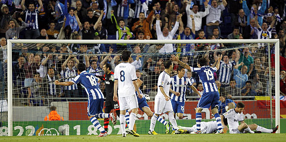 Espanyol's players celebrate a goal against Real Madrid during their La Liga match at Cornella-El Prat stadium on Sunday