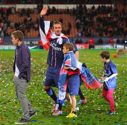 avid Beckham waves o the crowd with his sons, Brooklyn, Romeo and Cruz during the Ligue 1 match between Paris Saint-Germain FC and Stade Brestois 29 at Parc des Princes