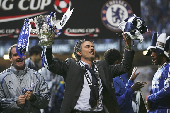 Jose Mourinho celebrates with the trophy