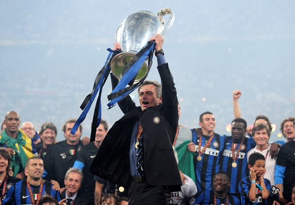 Jose Mourinho the Inter Milan coach holds the trophy aloft
