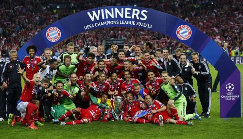 Bayern Munich players and staff celebrate with the trophy after winning the Champions League final soccer match at Wembley stadium