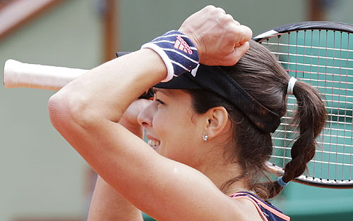 Ana Ivanovic of Serbia celebrates after defeating Petra Martic of Croatia in their first round match of the French Open at the Roland Garros on Sunday
