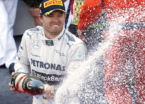 Mercedes Formula One driver Nico Rosberg of Germany sprays champagne after winning the Monaco F1 Grand Prix on Sunday