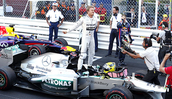 Mercedes Formula One driver Nico Rosberg of Germany celebrates near Red Bull driver Sebastian Vettel of Germany after winning the Monaco F1 Grand Prix on Sunday