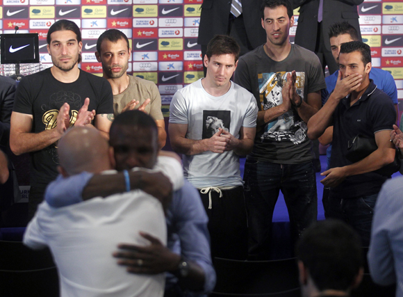Barcelona's soccer player Eric Abidal reacts during a news conference at Camp Nou