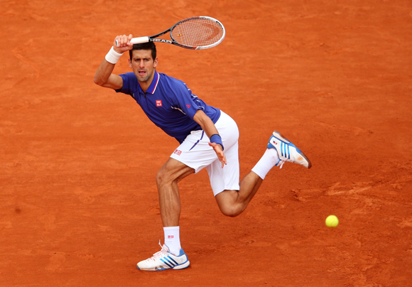 Novak Djokovic of Serbia plays a forehand in his match against Guido Pella of Argentina