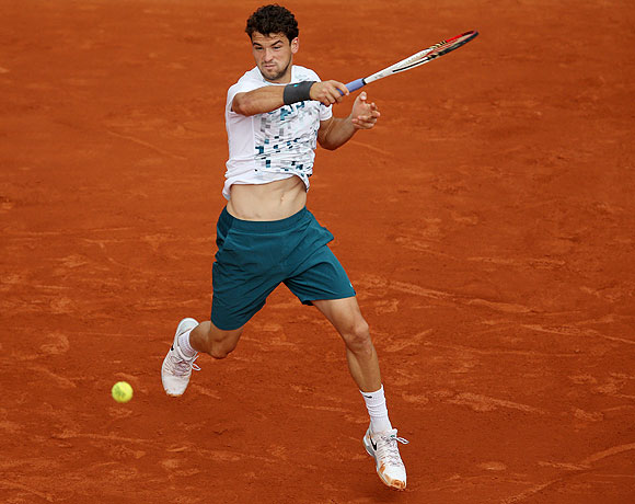 Grigor Dimitrov of Bulgaria plays a forehand against Lucas Pouille of France