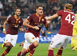 Marco Boriello celebrates with AS Roma teammates on Thursday