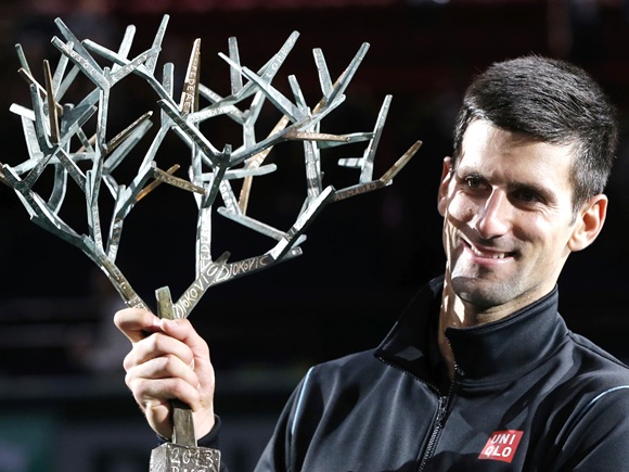 Novak Djokovic of Serbia holds his trophy