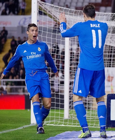 Cristiano Ronaldo of Real Madrid CF celebrates scoring his team's third goal with teammate Gareth Bale