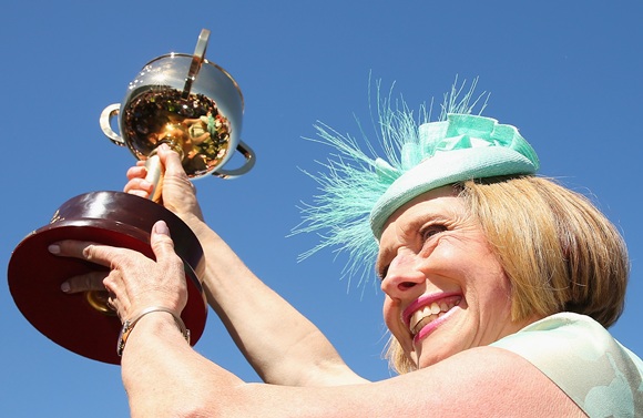 Gai Waterhouse the trainer of Fiorente holds up the Melbourne Cup after winning race 7 the Emirates Melbourne Cup