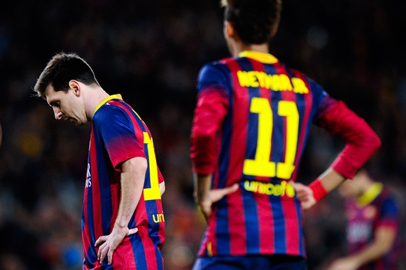 Lionel Messi of FC Barcelona looks down beside his teammate Neymar