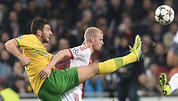 Celtic's Charlie Mulgrew (left) and Ajax Amsterdam's Davy Klaassen vie for possession during their Champions League match at Amsterdam Arena on Wednesday