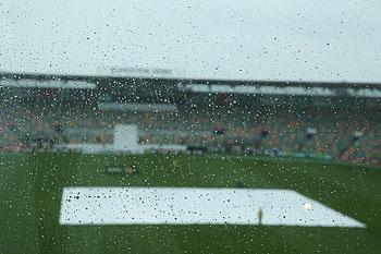 A general view is seen of rain drops on a window as rain delays the start of play during day two of the tour match between Australia A and England at the Bellerive Oval in Hobart on Thursday