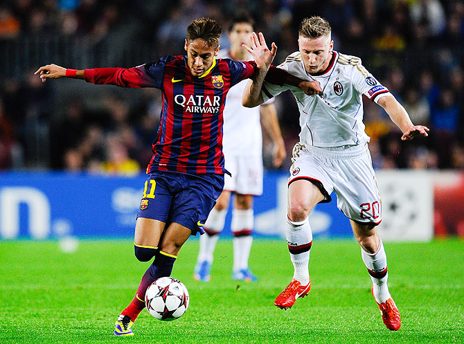 Neymar of FC Barcelona duels for the ball with Ignazio Abate of AC Milan during their UEFA Champions League Group H match at Camp Nou in Barcelona on Wednesday
