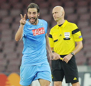 Gonzalo Higuain of Napoli celebrates after scoring their third goal during the UEFA Champions League Group F match against Olympique Marseille at Stadio San Paolo in Naples on Wednesday